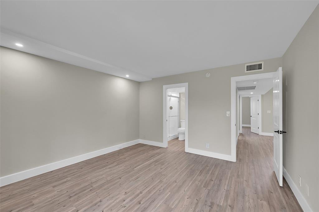 Lucaya Village Condominiums Coconut Creek, FL 33066 - Photo 13 of 28 wooden floor in an empty room with a window