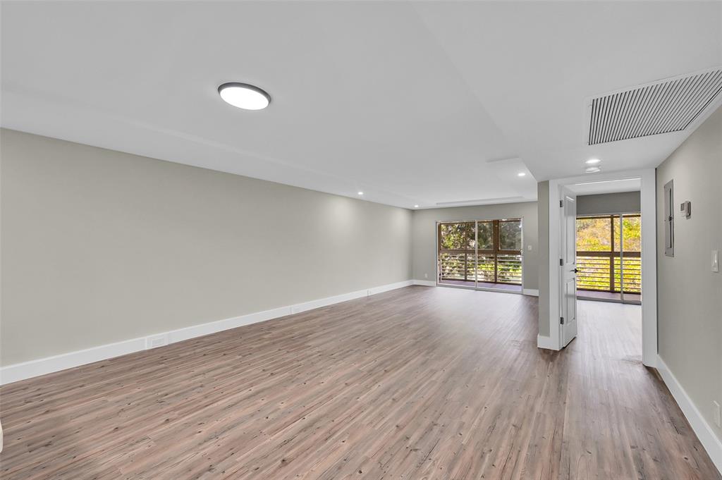 Lucaya Village Condominiums Coconut Creek, FL 33066 - Photo 21 of 28 an empty room with wooden floor and windows