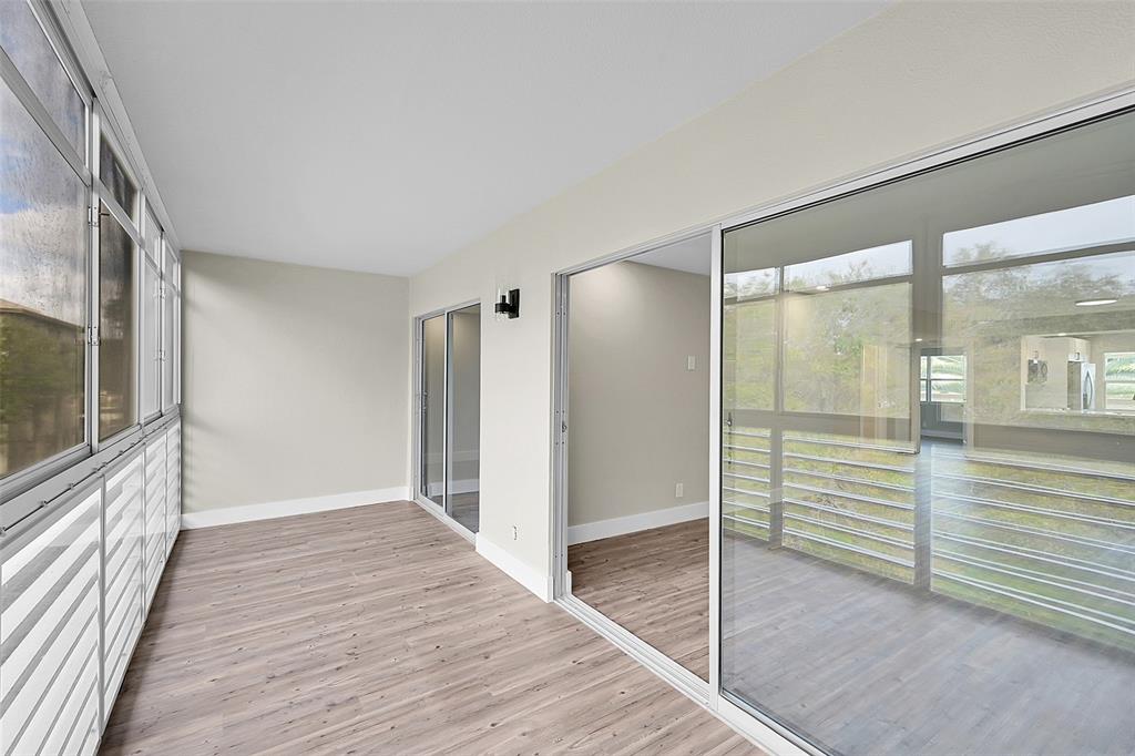 Lucaya Village Condominiums Coconut Creek, FL 33066 - Photo 24 of 28 a view of a hallway with wooden floor and staircase