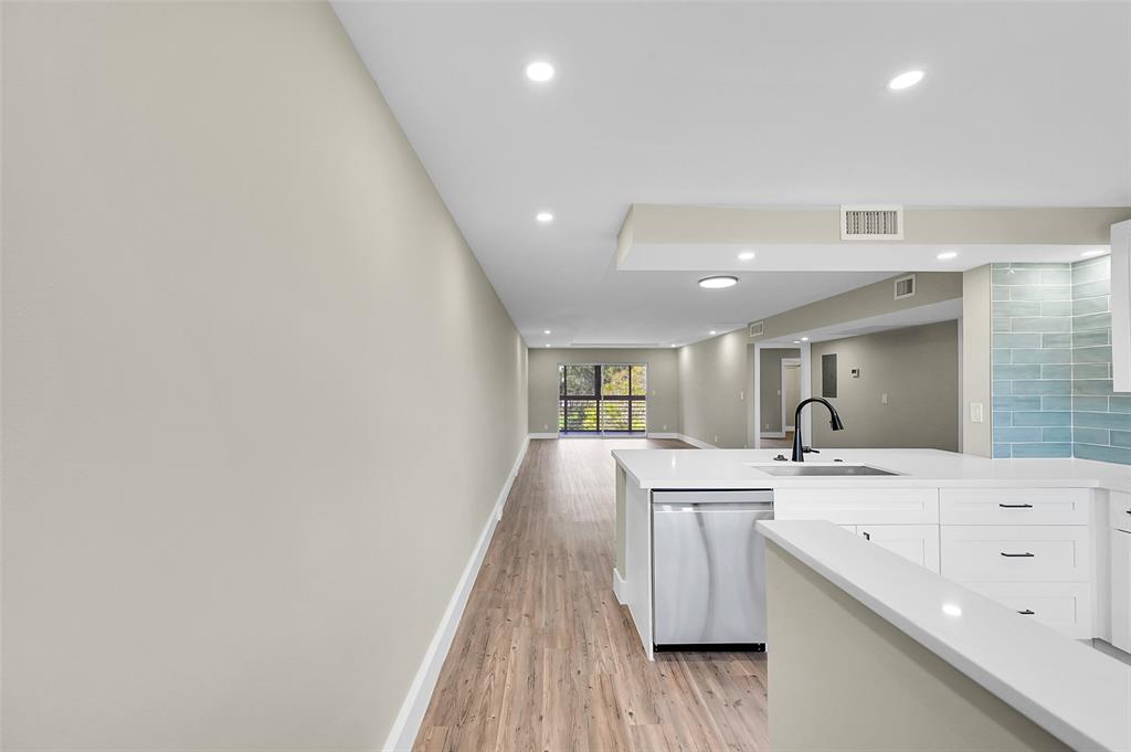 Lucaya Village Condominiums Coconut Creek, FL 33066 - Photo 5 of 28 a large room with a sink and wooden floor