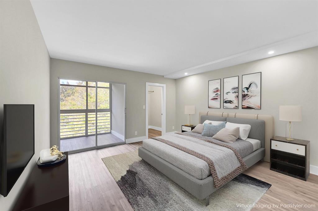 Lucaya Village Condominiums Coconut Creek, FL 33066 - Photo 10 of 28 a bedroom with a large bed and a large window