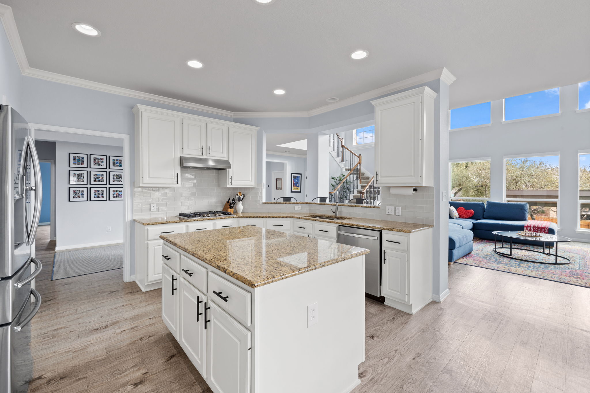 136 Eaton Lane Austin, TX 78737 - Photo 12 of 40 a kitchen with a sink stove and cabinets