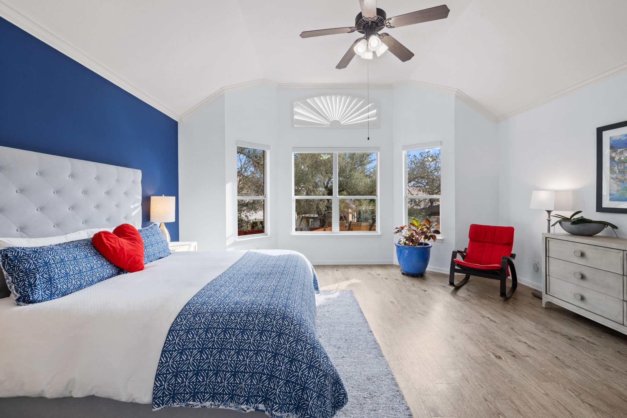 136 Eaton Lane Austin, TX 78737 - Photo 19 of 40 a bedroom with a bed and wooden floor