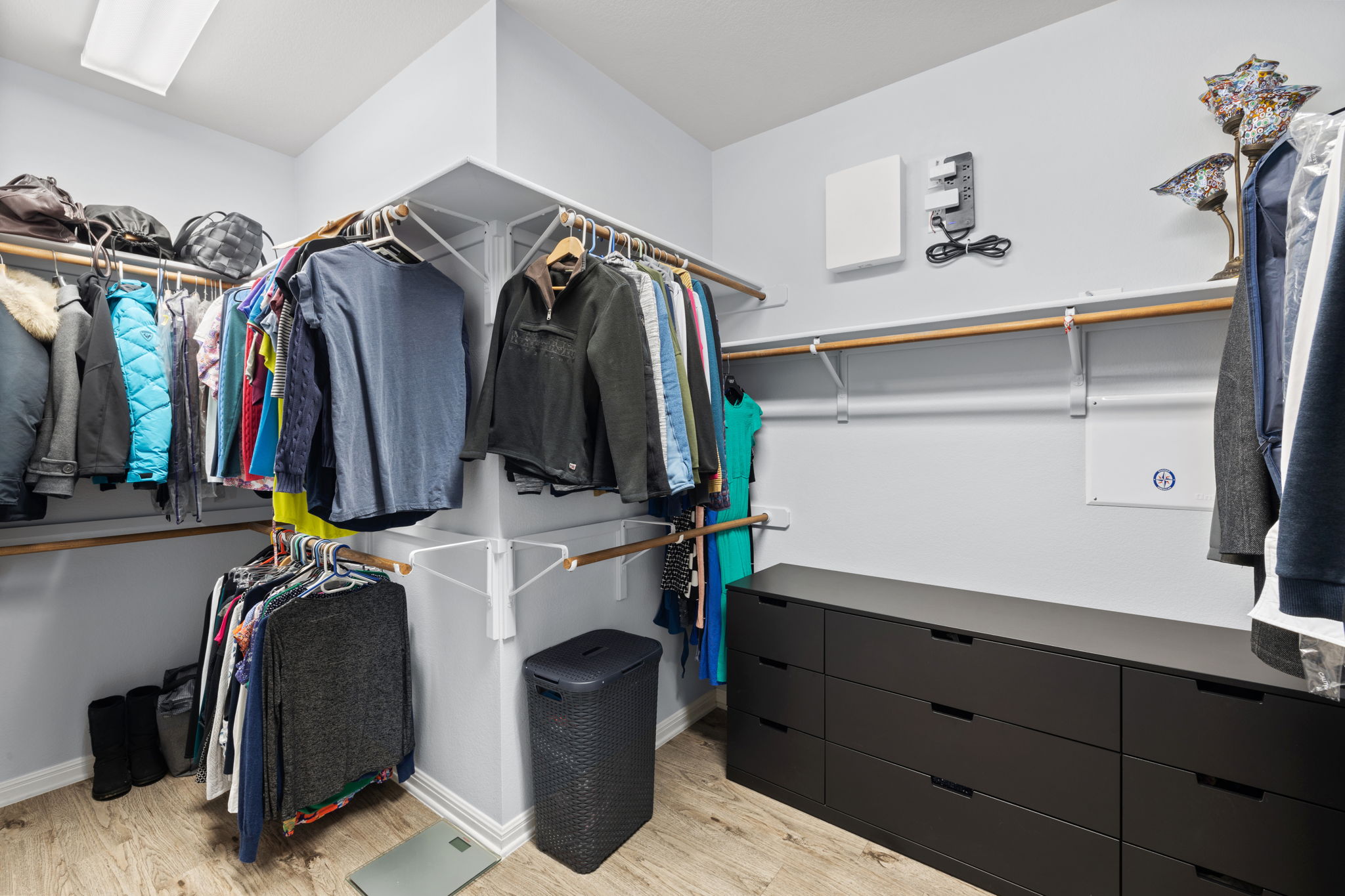 136 Eaton Lane Austin, TX 78737 - Photo 22 of 40 a view of walk in closet with clothes and shoes