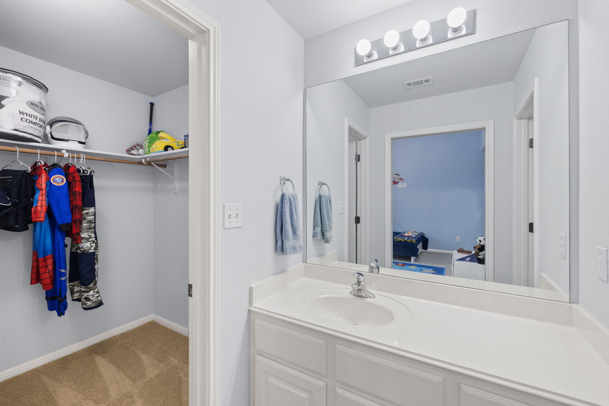 136 Eaton Lane Austin, TX 78737 - Photo 25 of 40 a bathroom with a sink and a mirror