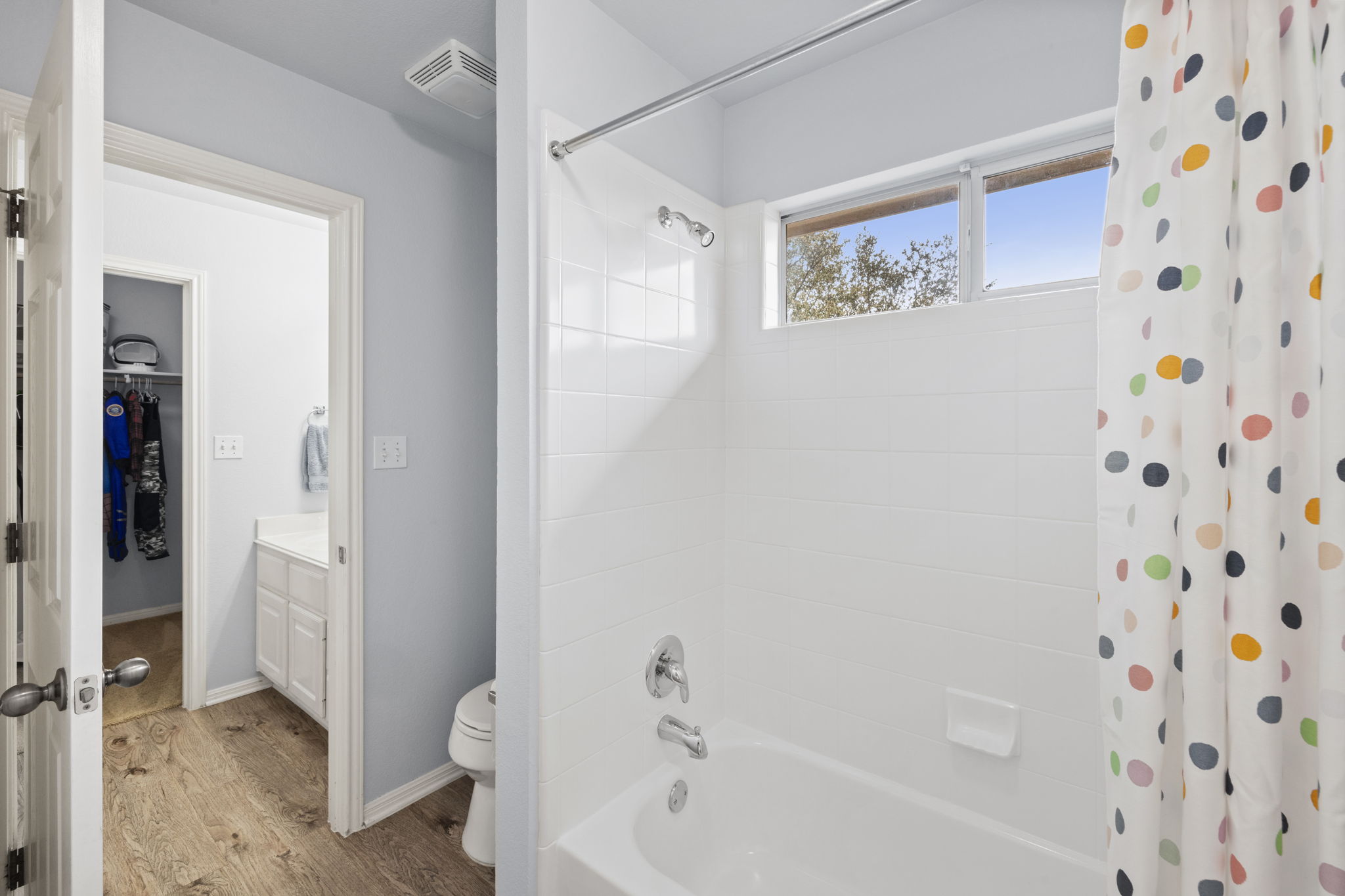 136 Eaton Lane Austin, TX 78737 - Photo 26 of 40 a bathroom with a bathtub and shower