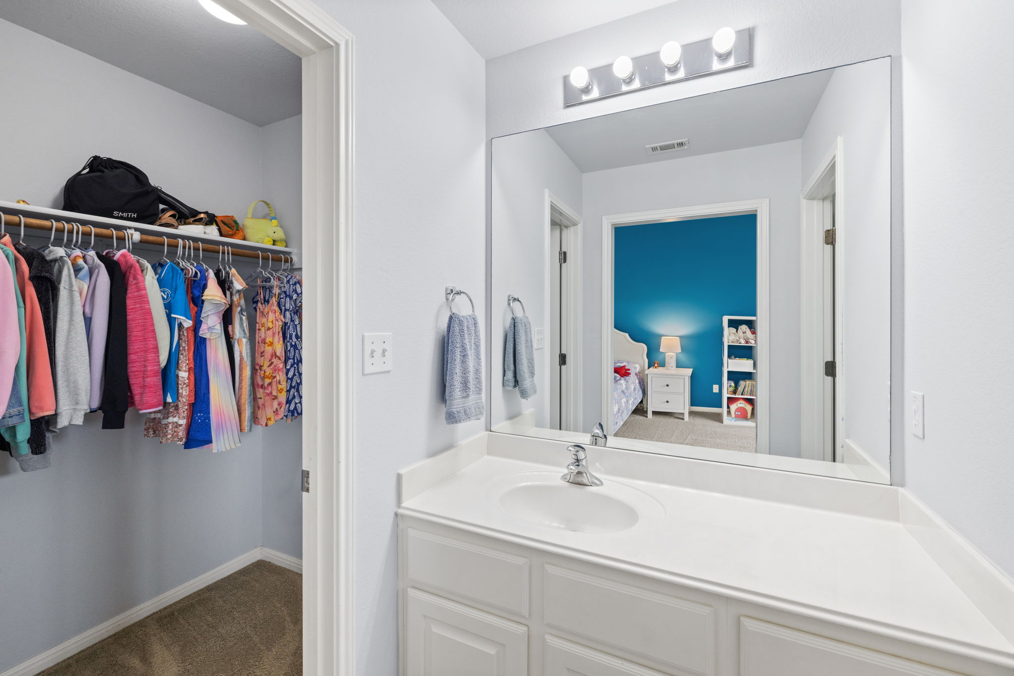 136 Eaton Lane Austin, TX 78737 - Photo 27 of 40 a bathroom with a sink and a mirror
