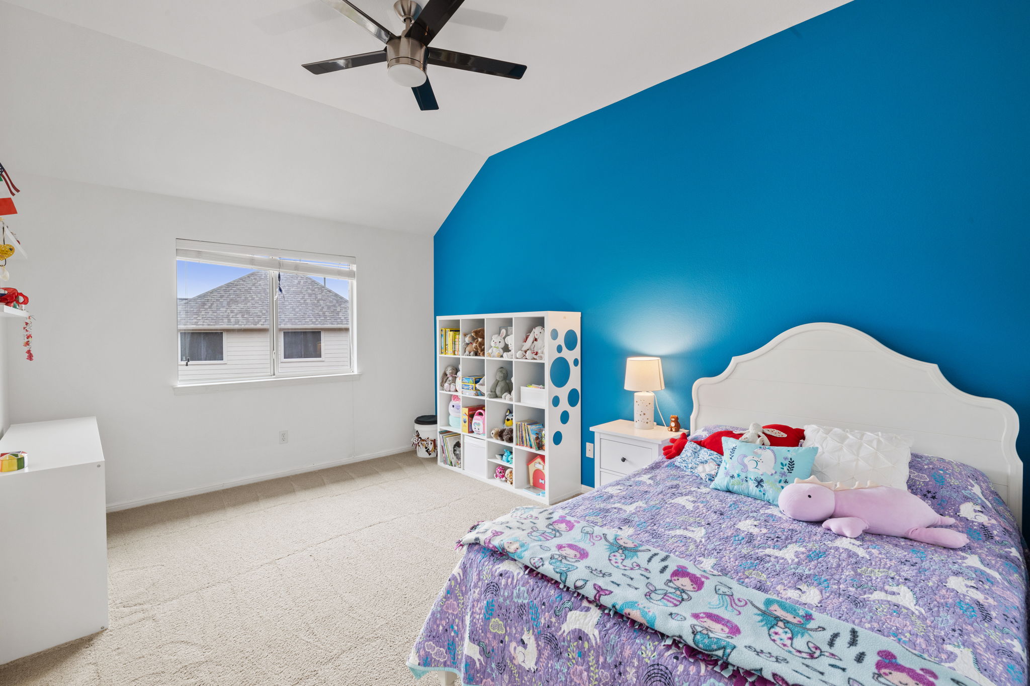 136 Eaton Lane Austin, TX 78737 - Photo 29 of 40 a bed room with a bed tub and a window