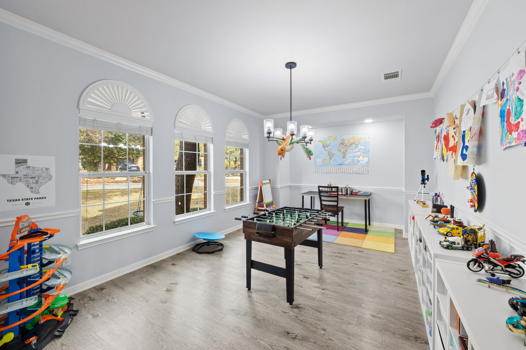 136 Eaton Lane Austin, TX 78737 - Photo 6 of 40 a living room with furniture and a chandelier