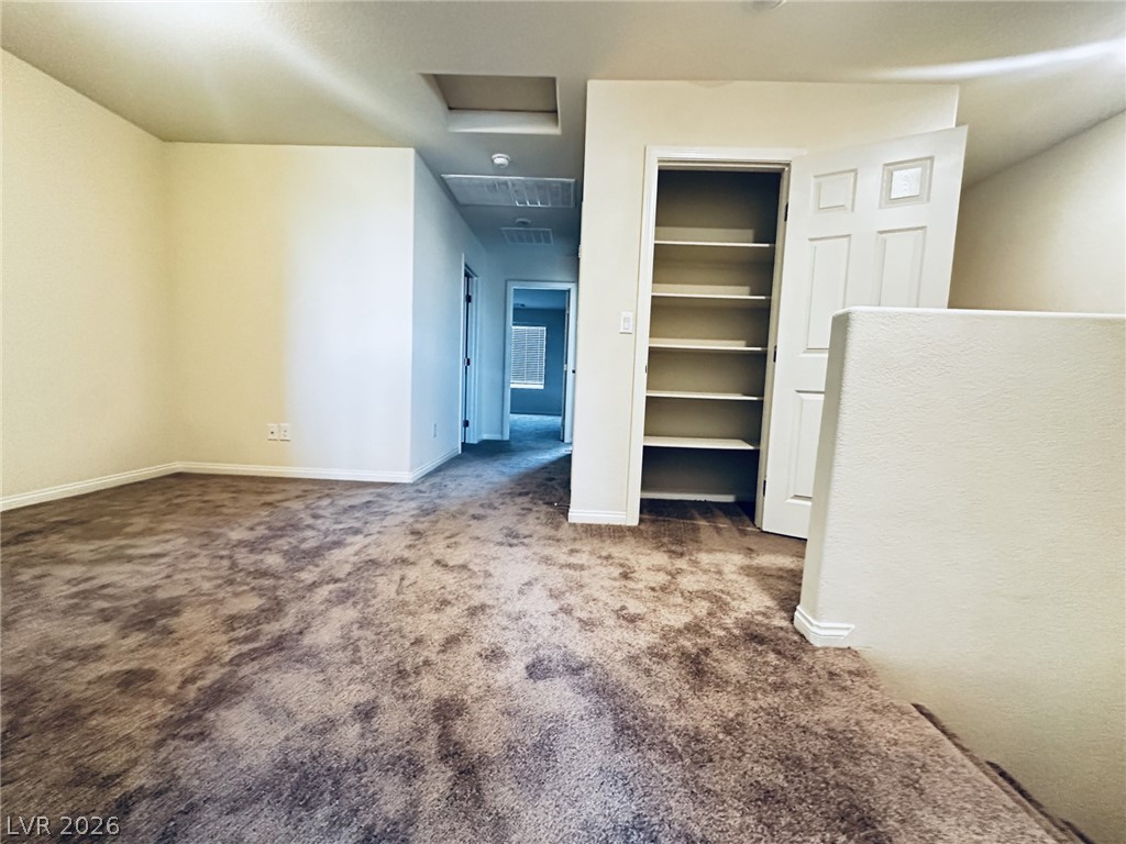 7331 Sunray Point Street North Las Vegas, NV 89084 - Photo 6 of 20 Ample built-in shelving provides generous storage space in this versatile loft area.