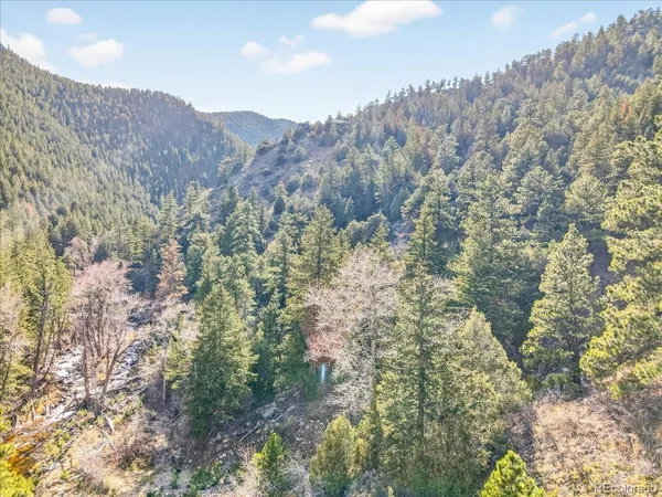 a view of a large mountain with a mountain in the background