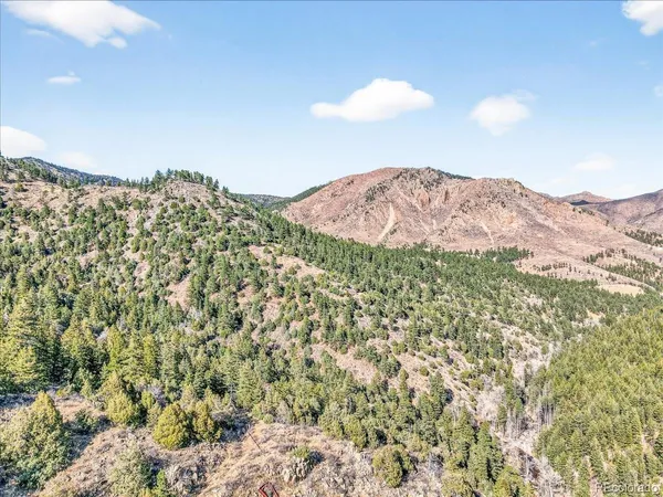 a view of a chairs and table in the patio