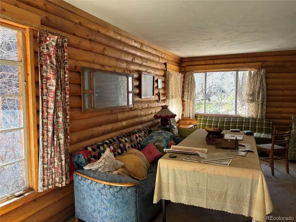 a view of a yard with large trees