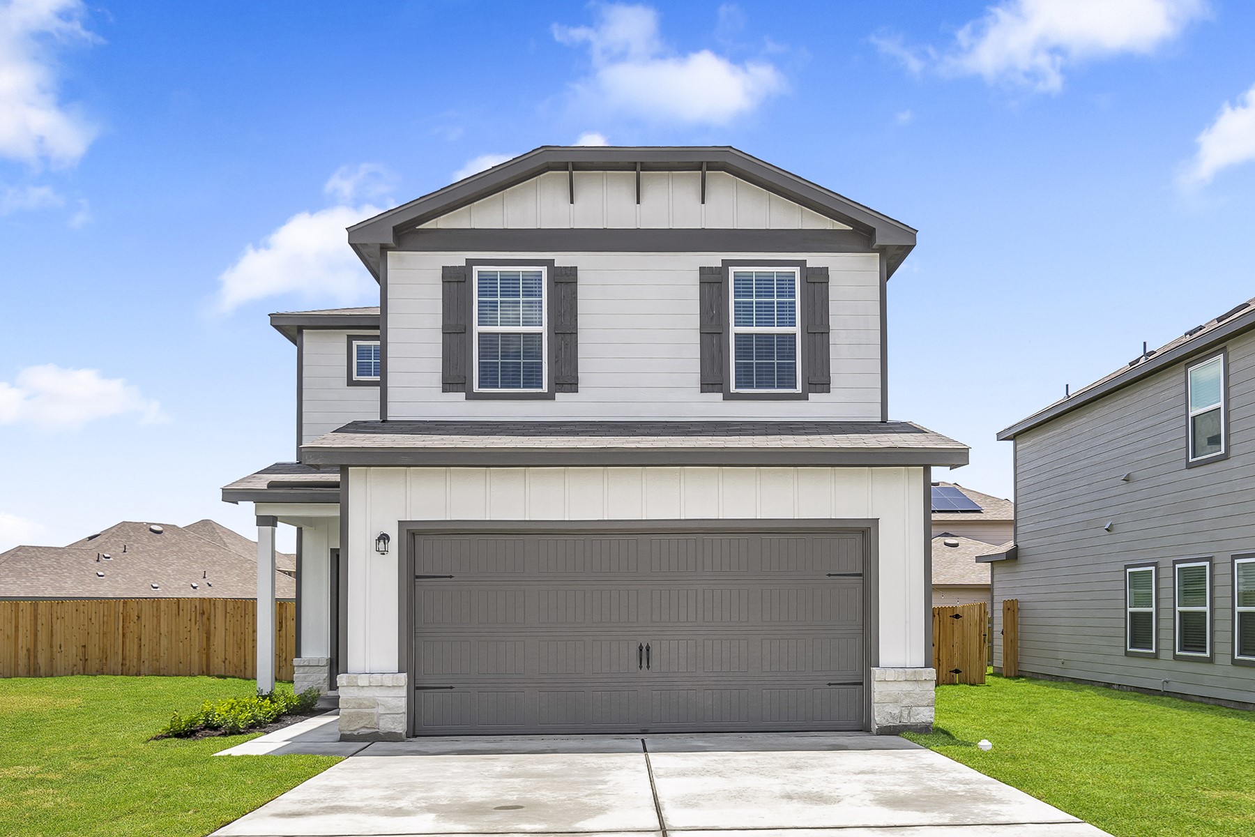 18424 Stellers Sea Street Elgin, TX 78621 - Photo 1 of 1 a front view of a house with a yard