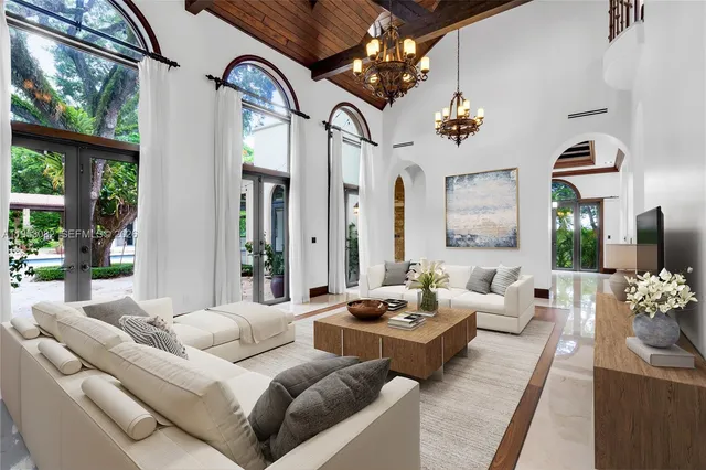a view of a hallway with entryway wooden floor and chandelier