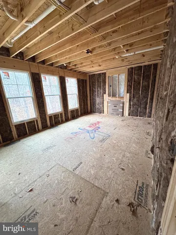 a large white bed in a small room