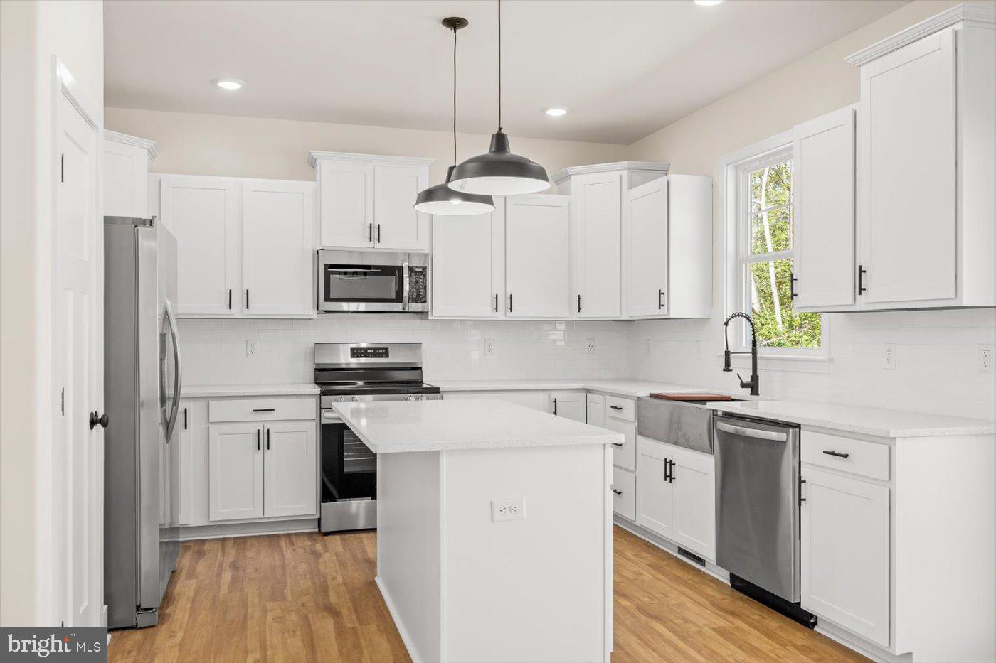 149 Morton Circle King George, VA 22485 - Photo 4 of 18 a kitchen with stainless steel appliances granite countertop a stove a refrigerator and a sink