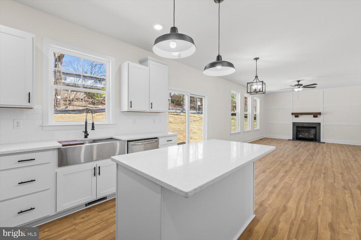 149 Morton Circle King George, VA 22485 - Photo 7 of 18 a kitchen with stainless steel appliances granite countertop a sink dishwasher and a stove with wooden floor