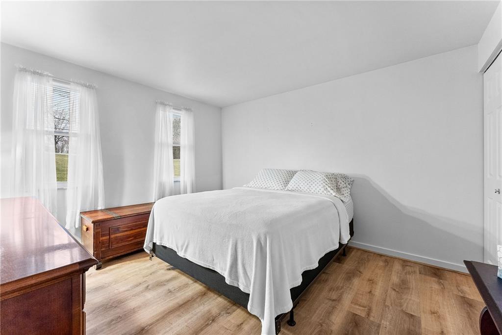 1257 Highway 989 Rochester, PA 15074 - Photo 13 of 40 a bedroom with a bed and window