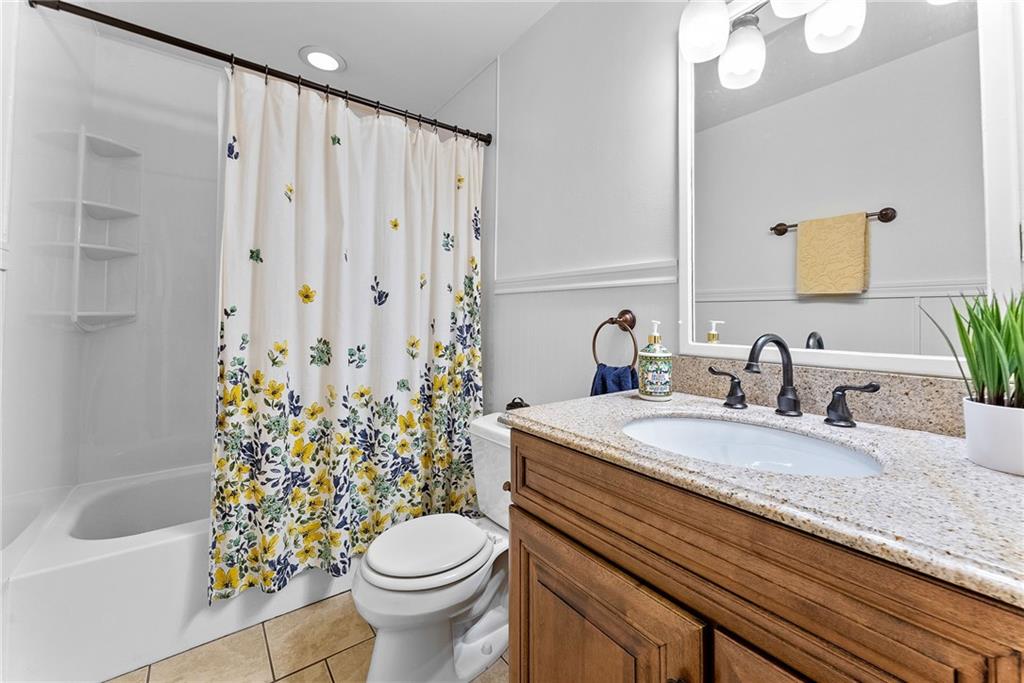 1257 Highway 989 Rochester, PA 15074 - Photo 18 of 40 a bathroom with a granite countertop sink toilet and shower