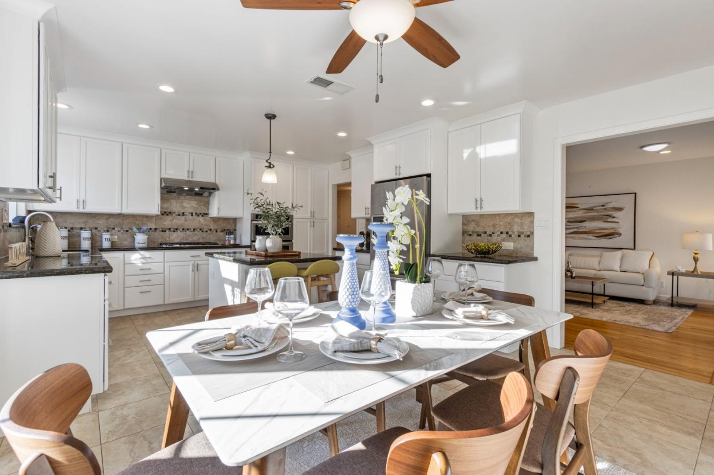 618 Azule Avenue San Jose, CA 95123 - Photo 18 of 48 a dining room with stainless steel appliances kitchen island granite countertop a dining table and chairs