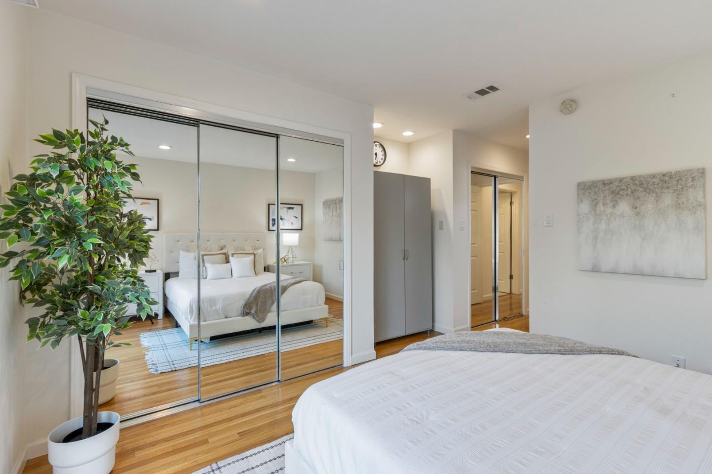 618 Azule Avenue San Jose, CA 95123 - Photo 28 of 48 a bedroom with a large bed and a potted plant