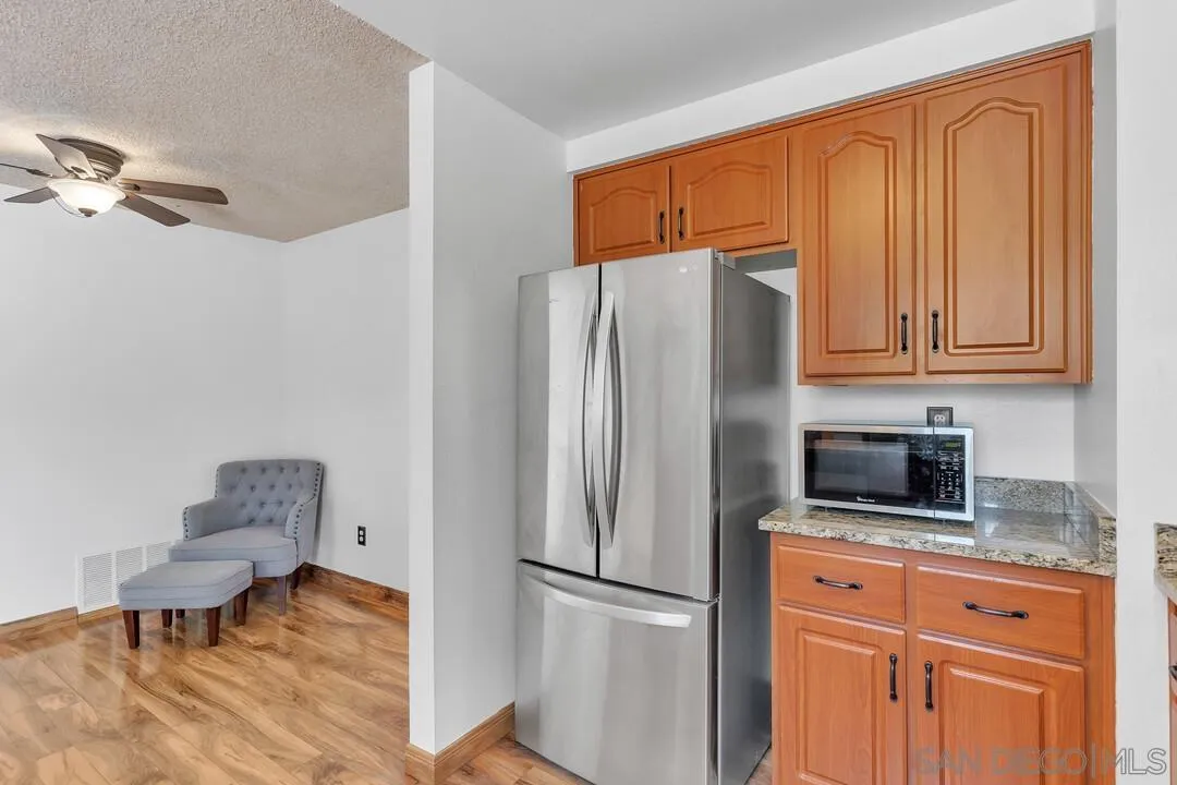 4021 Johnson Drive Oceanside, CA 92056 - Photo 11 of 25 a kitchen with stainless steel appliances granite countertop a refrigerator and a stove top oven