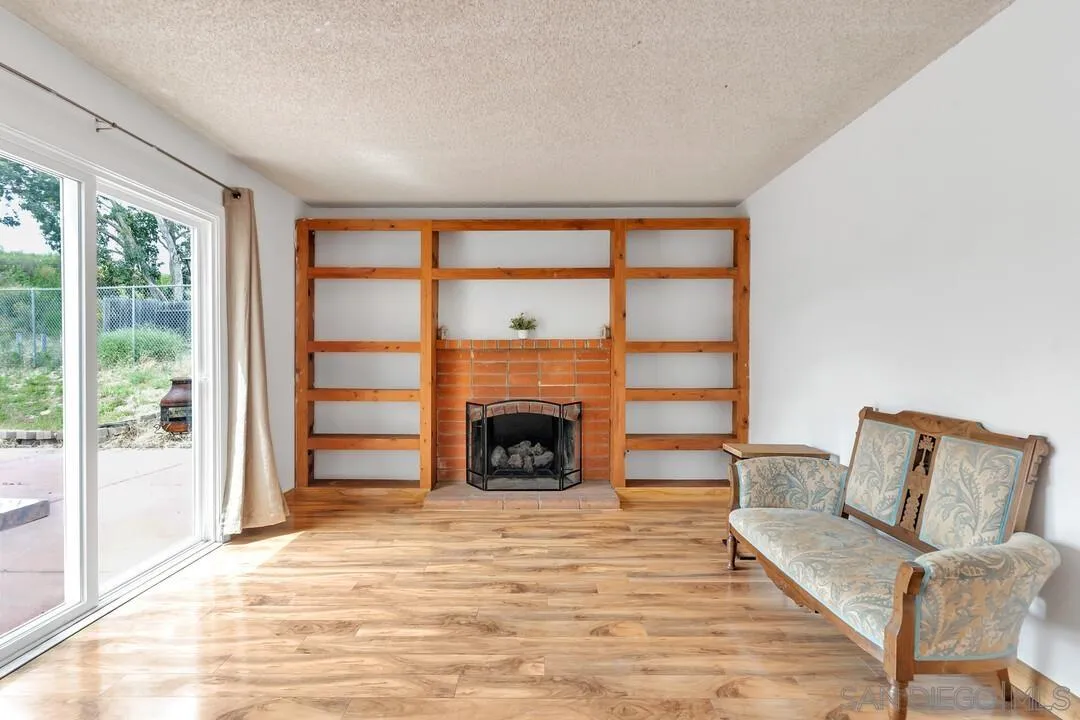 4021 Johnson Drive Oceanside, CA 92056 - Photo 13 of 25 a living room with furniture and a fireplace