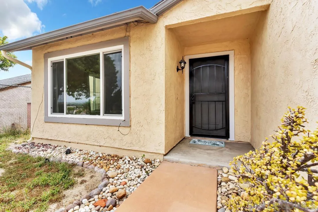 4021 Johnson Drive Oceanside, CA 92056 - Photo 3 of 25 a front view of a house with a blue gate