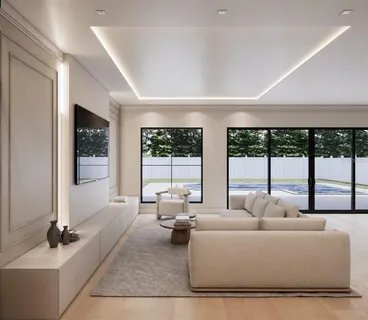 a living room with furniture and large windows
