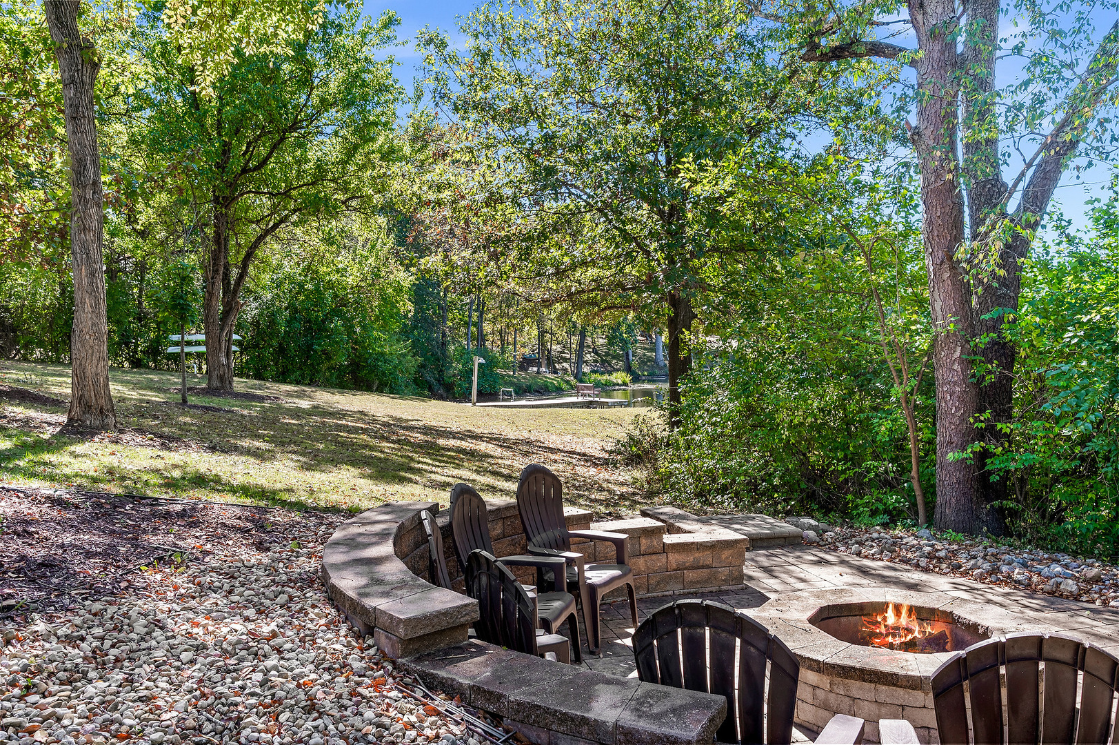 2296 Deer Ridge Court Carlock, IL 61725 - Photo 12 of 59 a view of a patio with table and chairs floor to ceiling window and trees