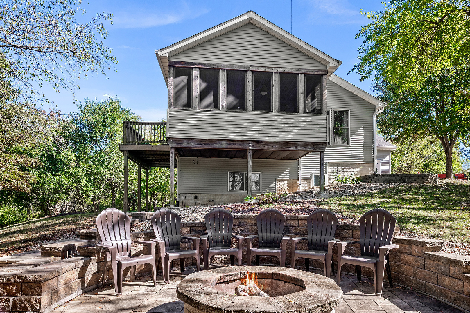 2296 Deer Ridge Court Carlock, IL 61725 - Photo 13 of 59 a table and chairs in front of a house