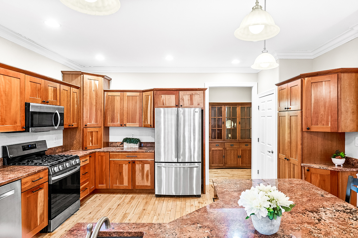 2296 Deer Ridge Court Carlock, IL 61725 - Photo 22 of 59 a kitchen with stainless steel appliances granite countertop a refrigerator stove and sink