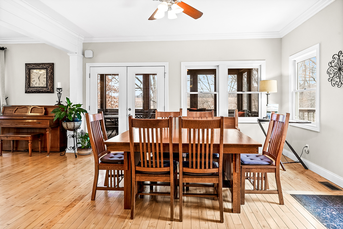 2296 Deer Ridge Court Carlock, IL 61725 - Photo 25 of 59 a dining room with furniture a rug and wooden floor