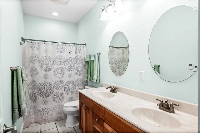 a living room with furniture and a lamp