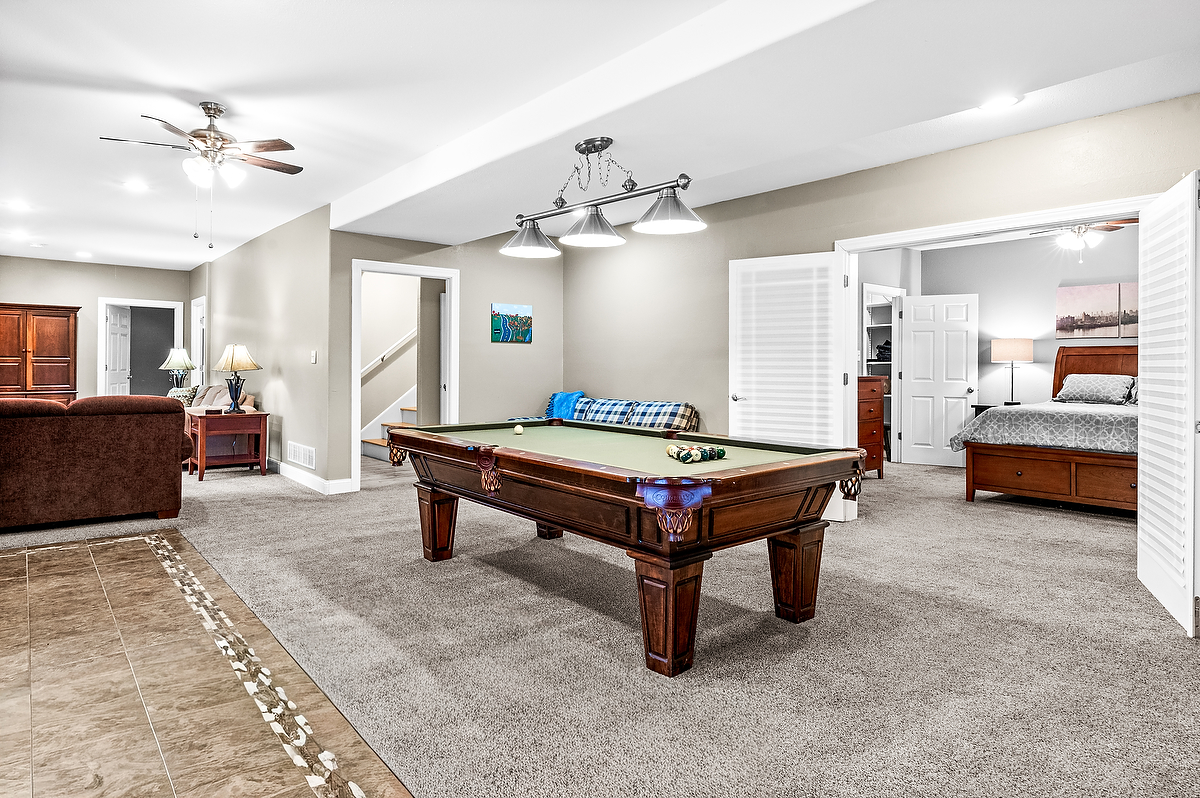 2296 Deer Ridge Court Carlock, IL 61725 - Photo 37 of 59 a living room with furniture and a chandelier