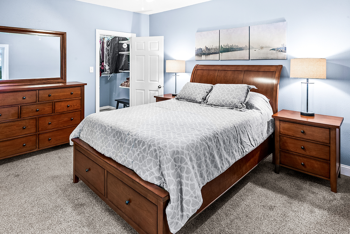 2296 Deer Ridge Court Carlock, IL 61725 - Photo 42 of 59 a bedroom with a bed and a night stand