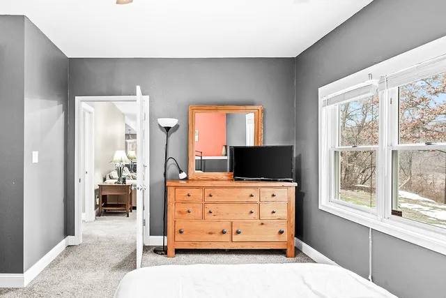 an aerial view of a house with yard and outdoor seating