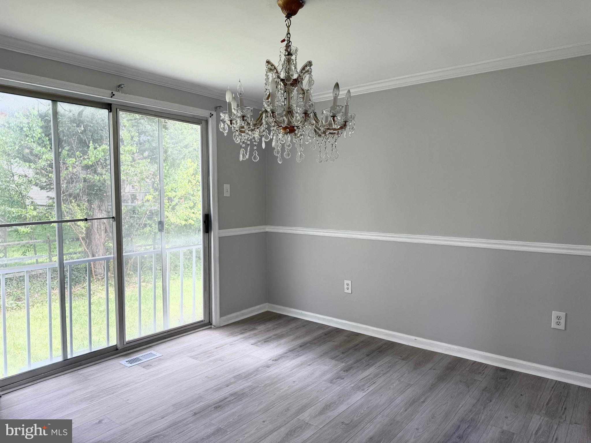 2 Cinnabar Court Gaithersburg, MD 20879 - Photo 11 of 46 wooden floor in an empty room with a window