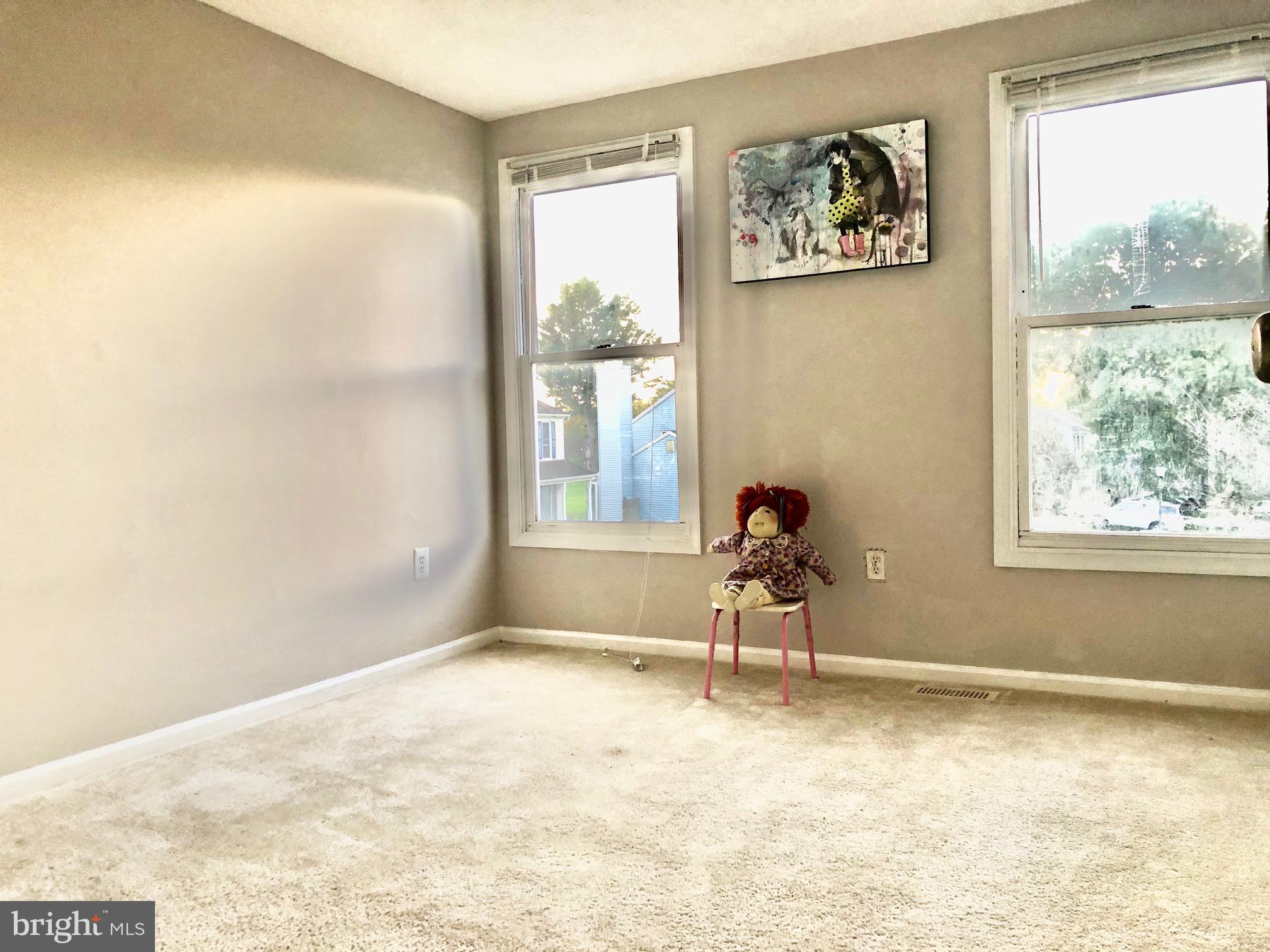 2 Cinnabar Court Gaithersburg, MD 20879 - Photo 13 of 46 a view of a livingroom with wooden floor and a window