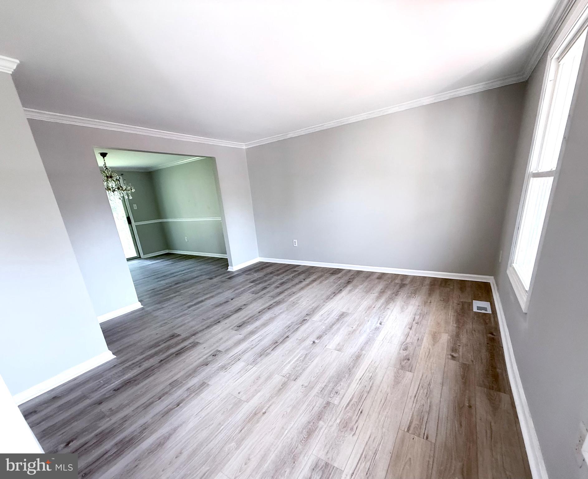 2 Cinnabar Court Gaithersburg, MD 20879 - Photo 14 of 46 an empty room with wooden floor and a window