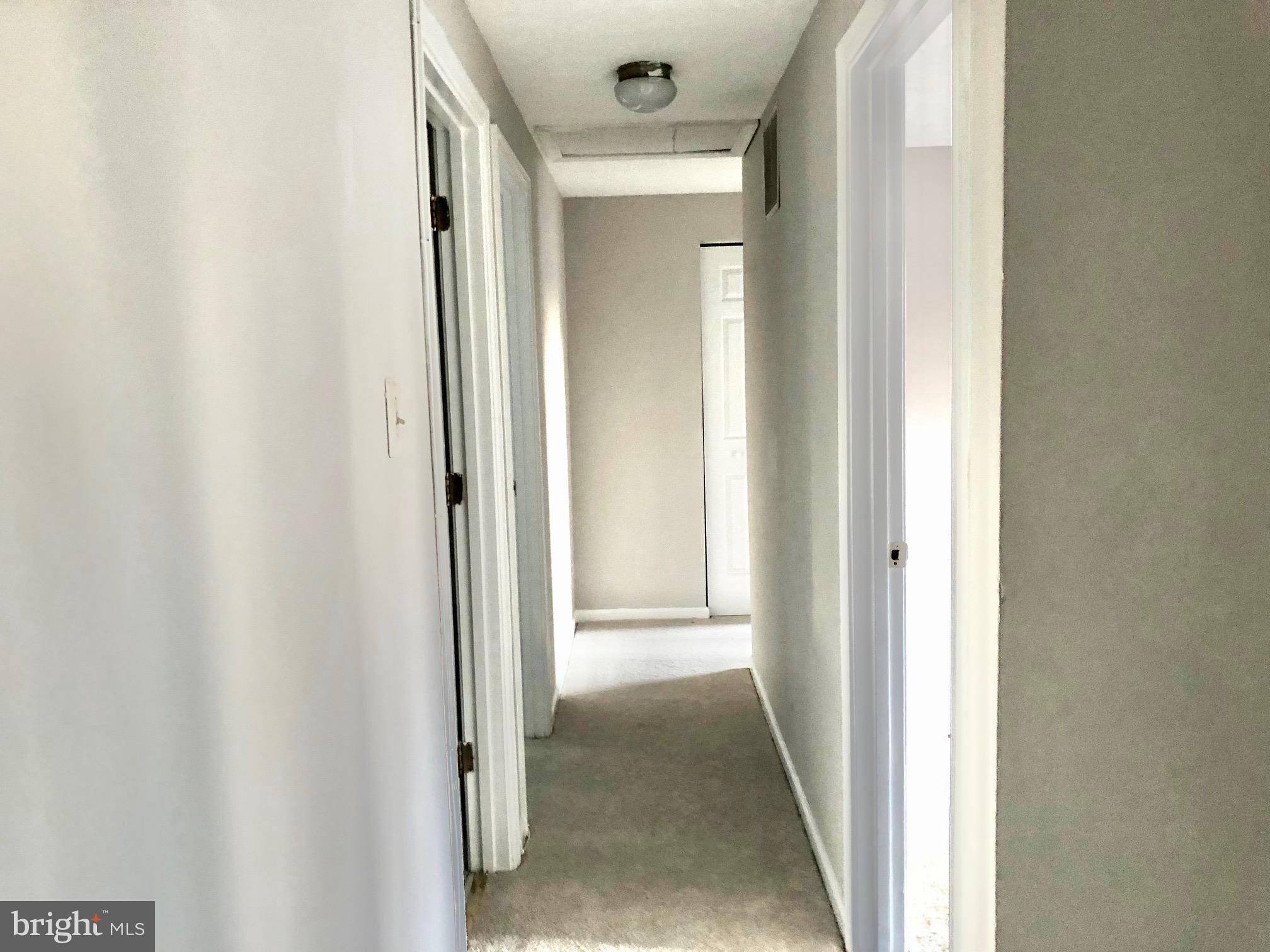 2 Cinnabar Court Gaithersburg, MD 20879 - Photo 17 of 46 a view of a hallway with wooden floor