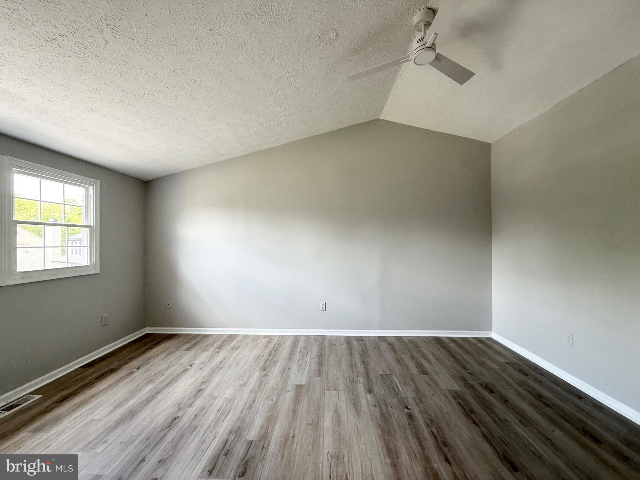 2 Cinnabar Court Gaithersburg, MD 20879 - Photo 18 of 46 an empty room with wooden floor and windows