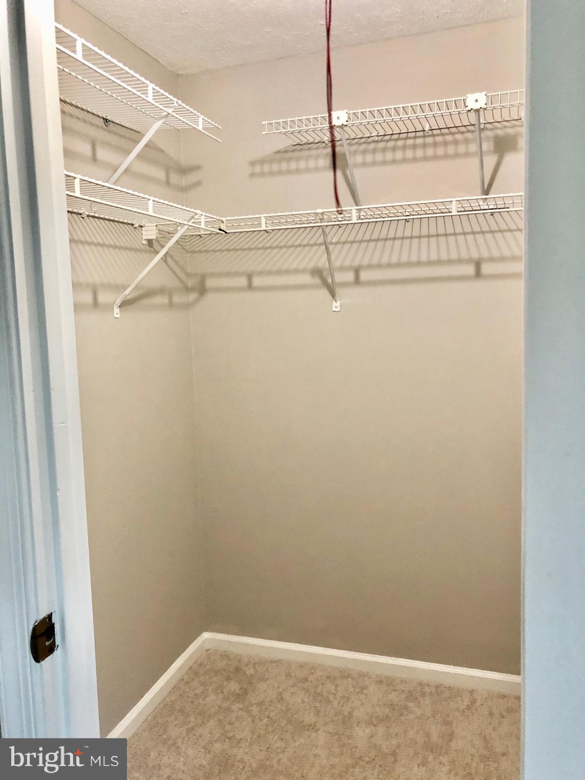 2 Cinnabar Court Gaithersburg, MD 20879 - Photo 24 of 46 a view of a room with racks on the wall
