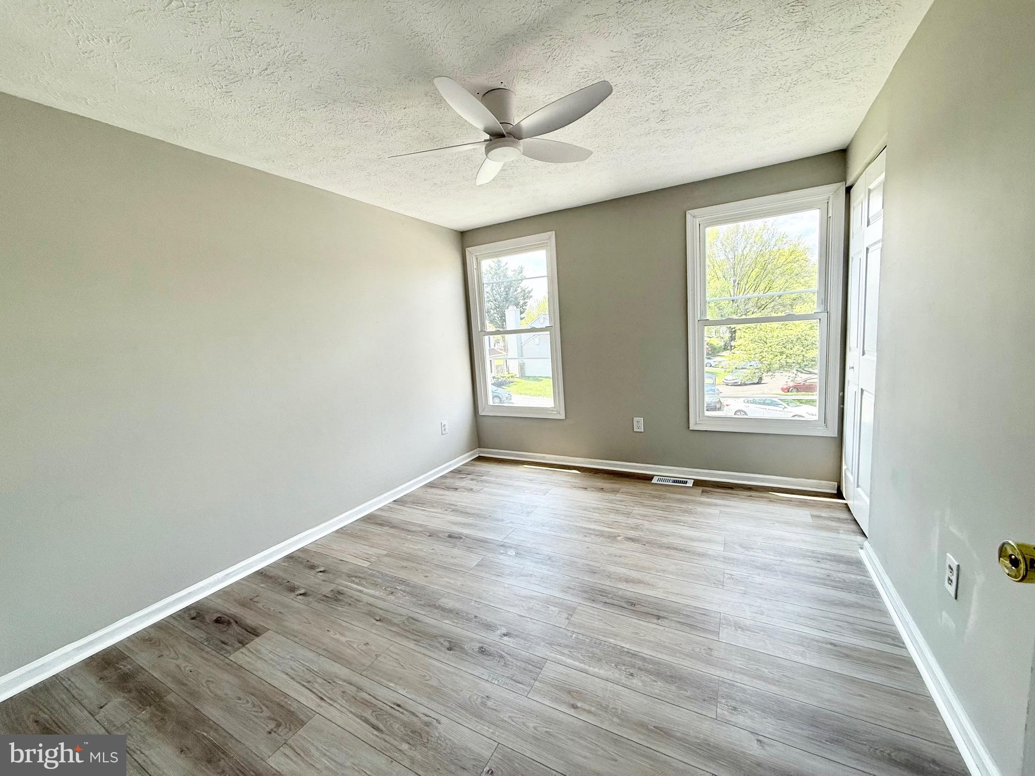 2 Cinnabar Court Gaithersburg, MD 20879 - Photo 28 of 46 an empty room with wooden floor and windows