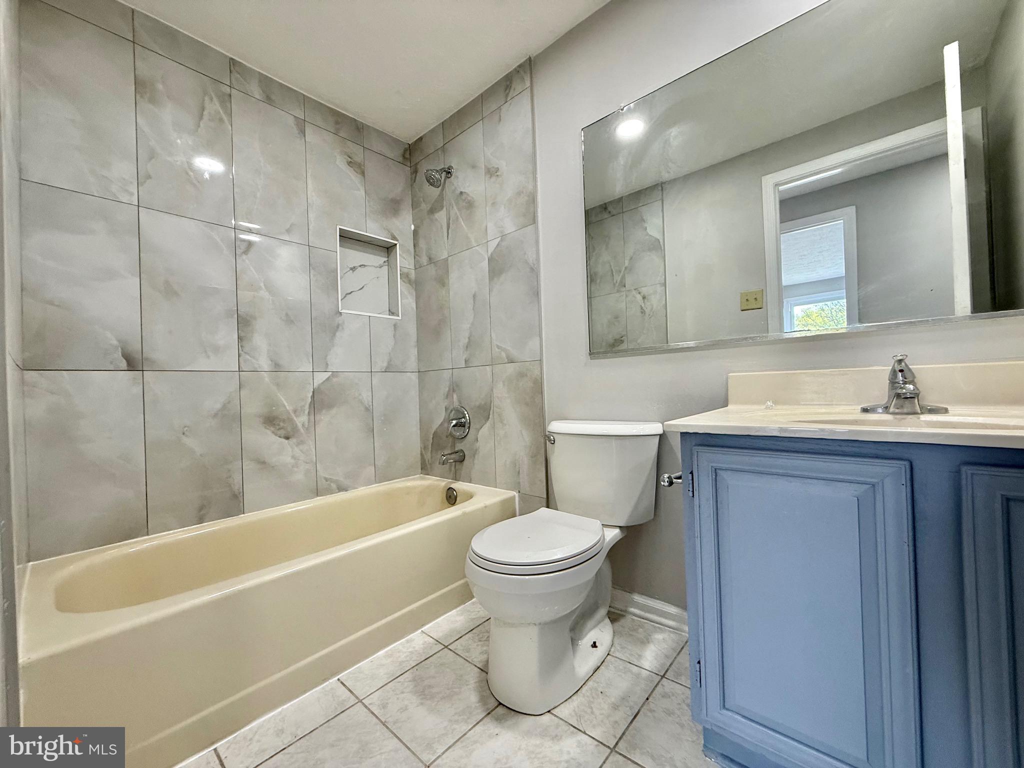 2 Cinnabar Court Gaithersburg, MD 20879 - Photo 35 of 46 a bathroom with a sink a toilet and a bathtub
