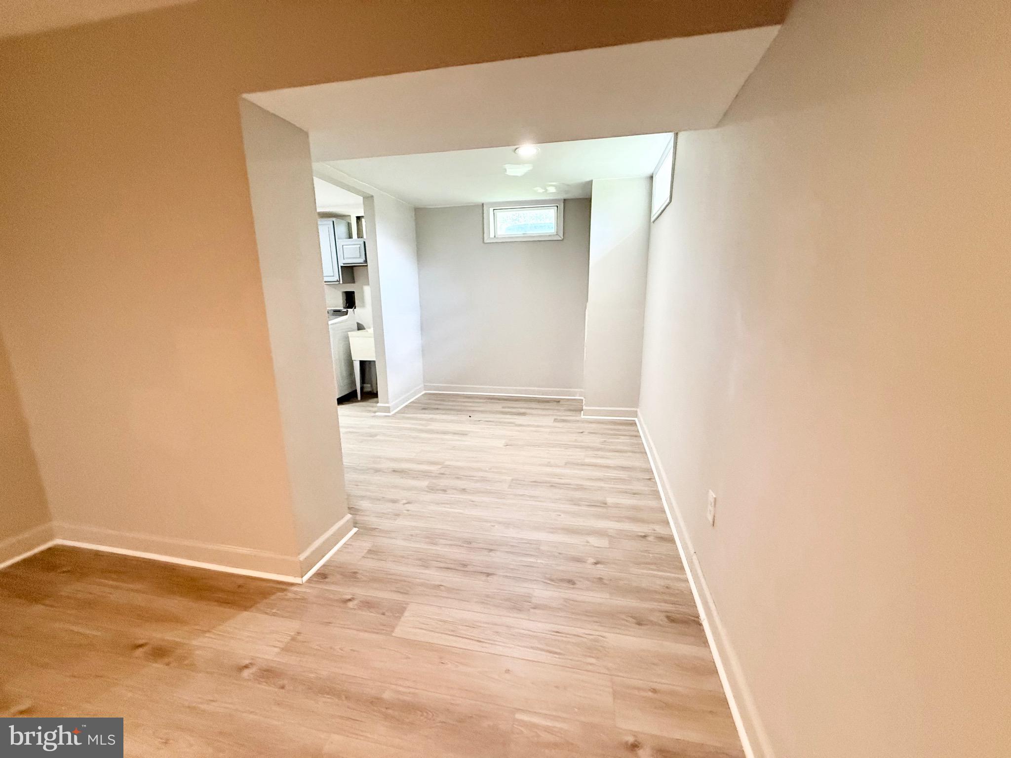 2 Cinnabar Court Gaithersburg, MD 20879 - Photo 39 of 46 a view of a hallway with wooden floor