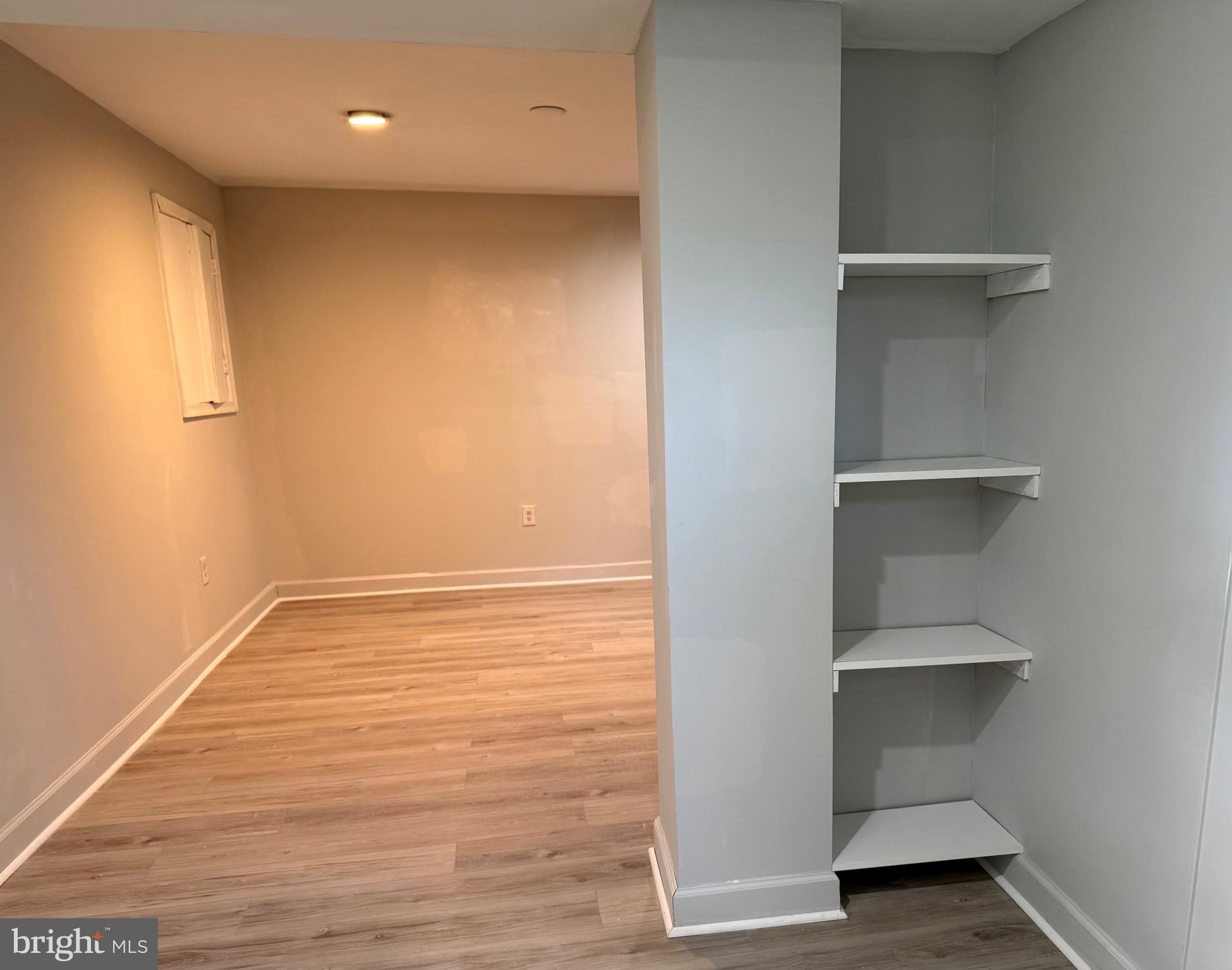2 Cinnabar Court Gaithersburg, MD 20879 - Photo 42 of 46 a view of an empty room with a wooden floor and a window
