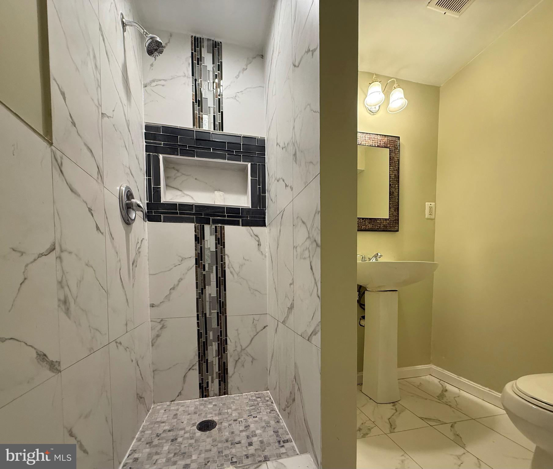 2 Cinnabar Court Gaithersburg, MD 20879 - Photo 44 of 46 a bathroom with a sink a toilet and shower