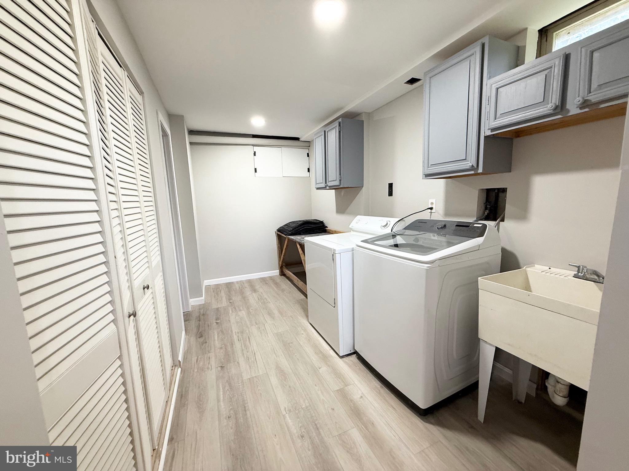 2 Cinnabar Court Gaithersburg, MD 20879 - Photo 45 of 46 a view of a kitchen with sink and wooden floor